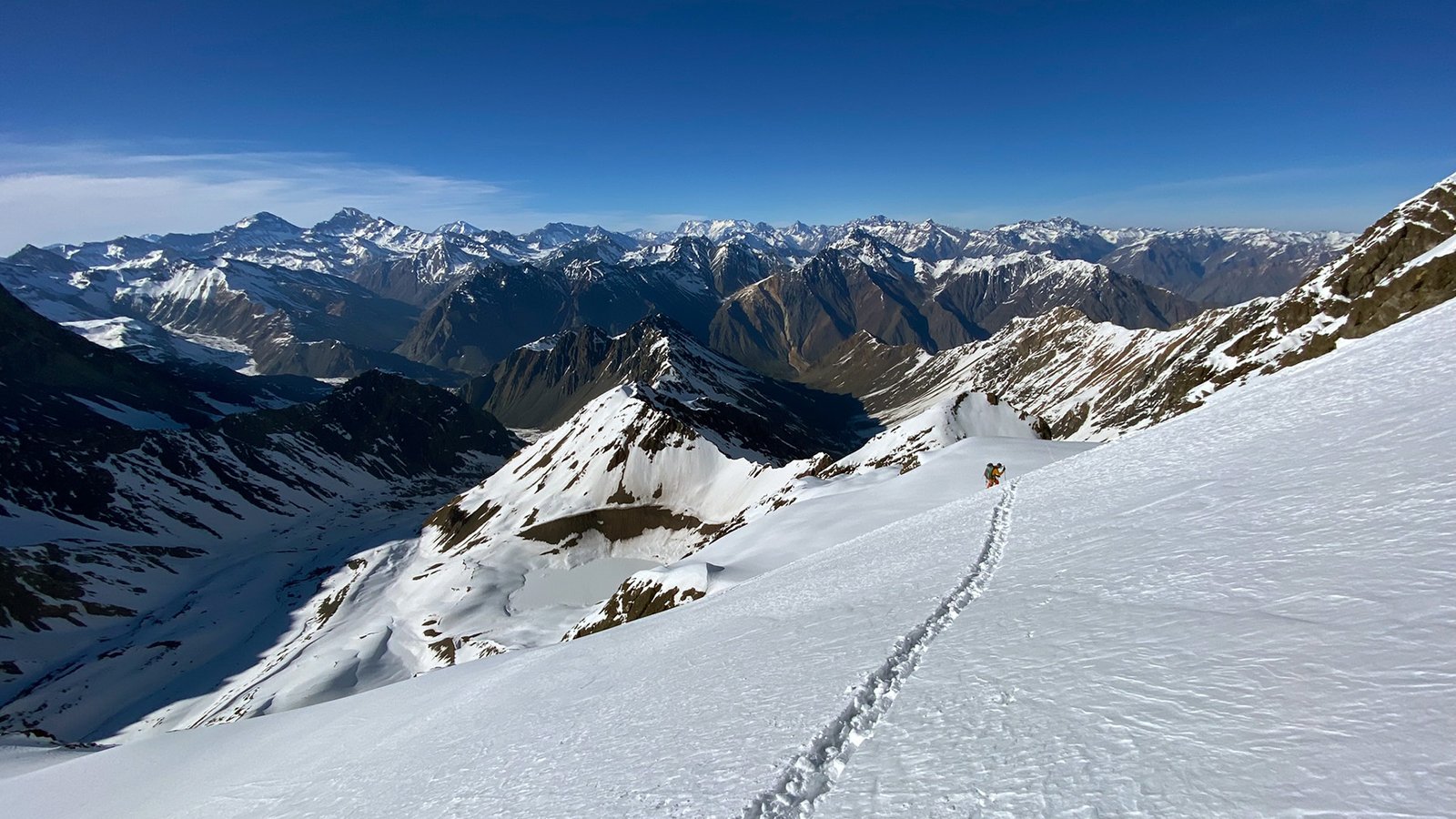 Skier descending through backcountry in the Central Andes (Santiago)